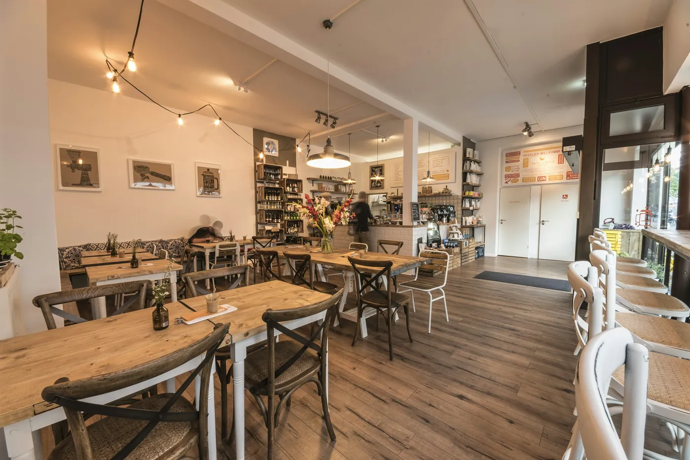An independent café with wooden tables, set for the day